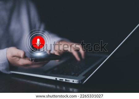 Businessman using smartphone touch microphone button on virtual screen. Blog blog speak talk advertising presentation,Voice recognition, speech detection and deep learning application,Voice Assistance