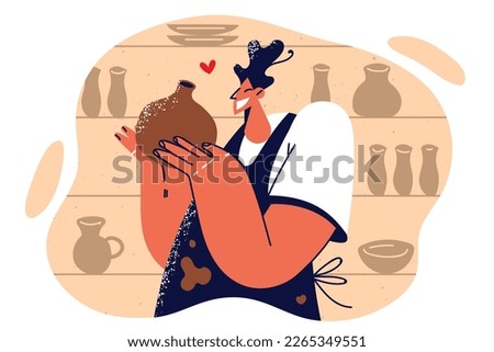 Woman employee of pottery store demonstrates vase made from natural clay for sale at crafts fair. Girl artisan proudly shows handmade dishes created by professional ceramist from pottery workshop  Royalty-Free Stock Photo #2265349551