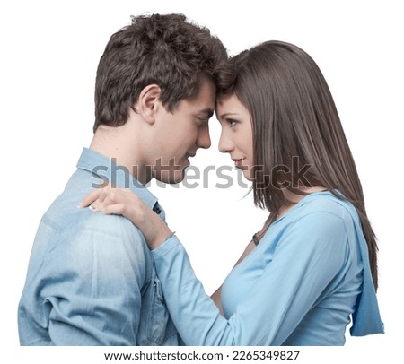 Romantic happy couple touching foreheads and staring at each other's eyes Royalty-Free Stock Photo #2265349827