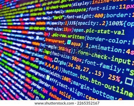 Closeup of Web Code on Computer LED Screen. HTML code on laptop screen. Closeup of Java Script, CSS and HTML. Programmer occupation. Finance data concept. Coding application by programmer developer