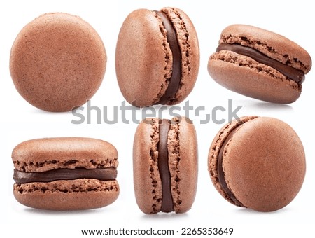 Chocolate french macaroon cookies isolated on white background. Royalty-Free Stock Photo #2265353649