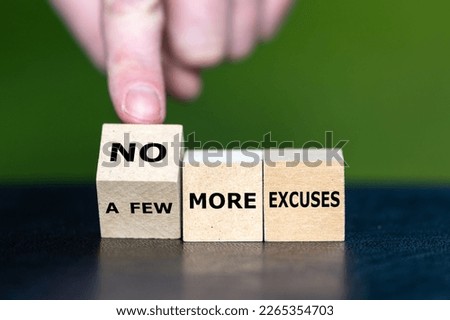 Hand turns a wooden cube and changes the expression 'a few more excuses' to 'no more excuses'. Royalty-Free Stock Photo #2265354703
