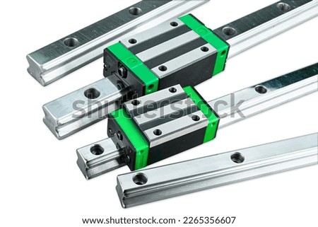 linear guide rail with sliding block isolated on white background. CNC milling or lathe machine part component concept Royalty-Free Stock Photo #2265356607