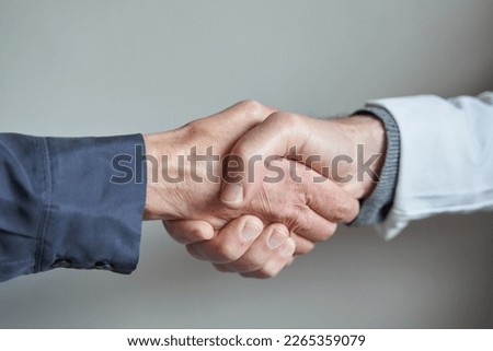 doctor patient trust bond concept. Confidentiality. Female patient and male doctor shake hands Royalty-Free Stock Photo #2265359079