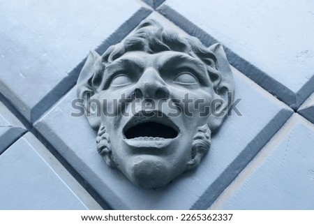 Close up fragment of medieval metal doors with decorative head concept photo.