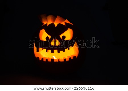 Scary Jack-O-Lantern halloween pumpkin with candle light