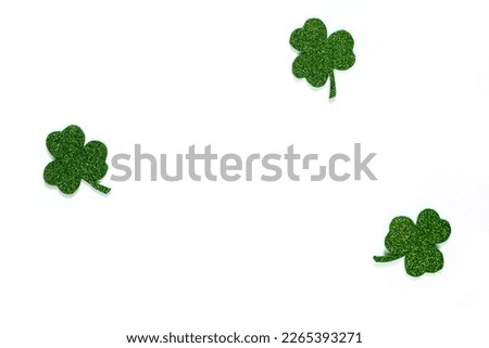 Happy St. Patrick's Day banner.Holiday background.St Patricks Day frame against a white background. Flat lay shamrocks.Copy space.Patrik's day banner Royalty-Free Stock Photo #2265393271