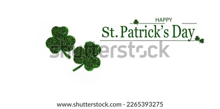 Happy St. Patrick's Day banner.Holiday background.St Patricks Day frame against a white background. Flat lay shamrocks.Copy space.Patrik's day banner Royalty-Free Stock Photo #2265393275