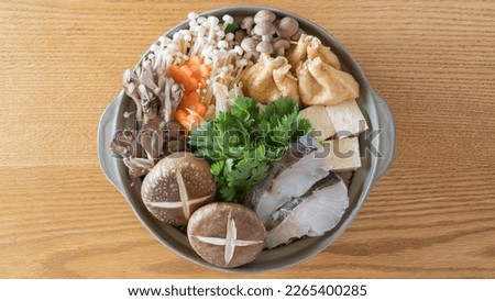 Japanese hot pot image."Nabe" is a  Japanese stew.It contains a lot of vegetables and fish.