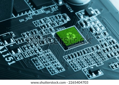 Concept of green technology. green recycle sign on circuit board technology innovations. Environment Green Technology Computer Chip.Green Computing, Technology,  CSR, and IT ethics