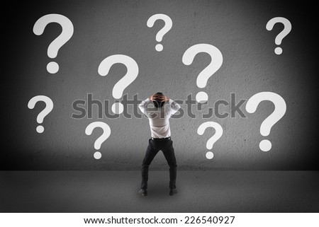 Confuse businessman and a question mark