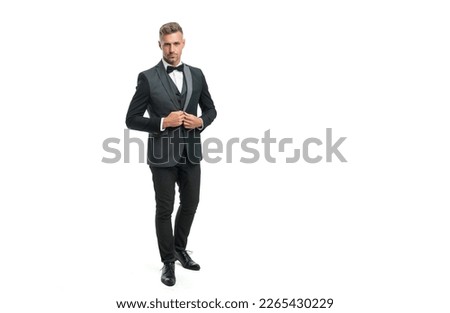 full length of man in bow tie suit. businessman isolated on white. formal wear concept. Royalty-Free Stock Photo #2265430229