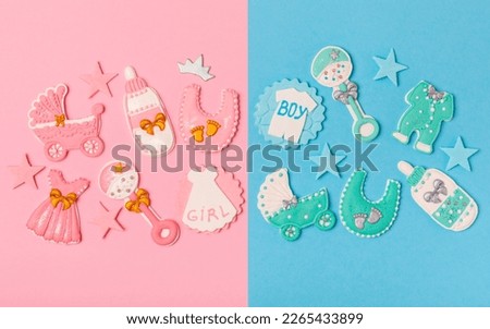 Boy or girl? Gender party. Gender cookies. Baby shower cookies on a vibrant pink and blue background. Candy bar holiday baby shower party. Holiday concept.