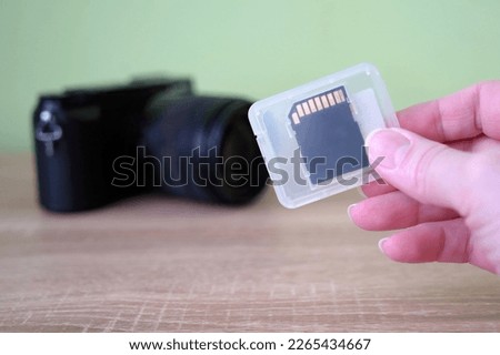 SD card into laptop computer, Export or transfer data files, images and videos from camera to laptop through multifunctional adaptor or cardreader, closeup