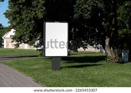 Blank billboard sign board mockup in the urban environment, empty space to display your advertising or branding campaign Royalty-Free Stock Photo #2265453307