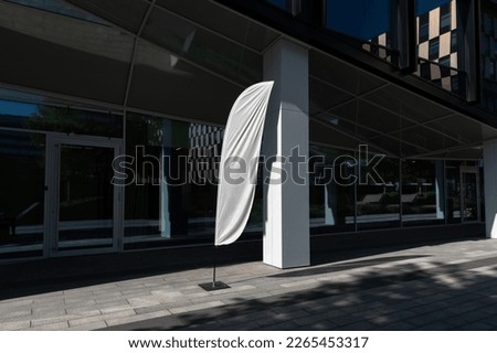 Flag sign mockup in the urban environment, empty space to display your advertising or branding campaign