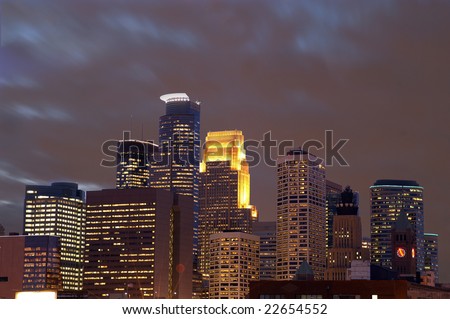 Minneapolis city skyline at dusk with moving clouds
