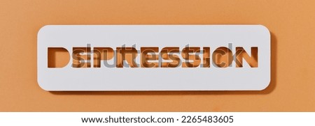 closeup of a paper sign with the text depression on a brown background, in a panoramic format to use as web banner or header Royalty-Free Stock Photo #2265483605