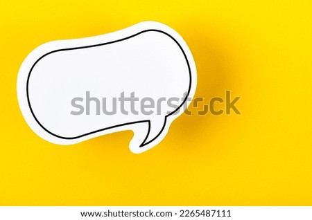 A Speech bubble with copy space communication talking speaking concepts on yellow background.