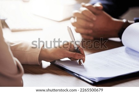 Business people, hands and signing contract, form or application for hire, recruitment or policy on table. Hand of person writing or filling in paperwork with pen for deal, agreement or information