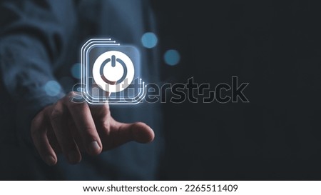 Businessman pressing power button concept. Digital technology touch screen. Hardware equipment concept. Royalty-Free Stock Photo #2265511409