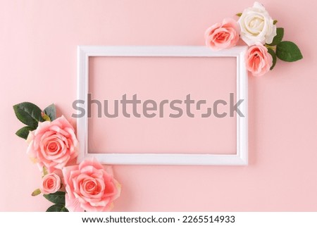 Happy Women's Day decoration concept made from rose flower place around frame picture on pastel background.