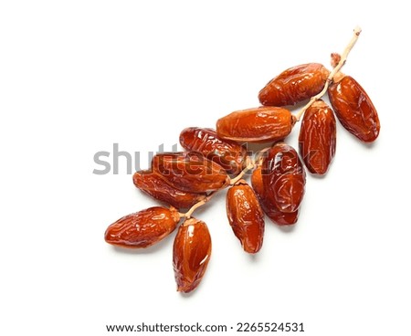 Top view of dried dates fruits with stem isolated on white background. Clipping path. Royalty-Free Stock Photo #2265524531