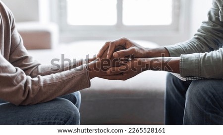 Cropped of black man psychologist holding hands of woman patient provide professional aid psychological help close up, show support express empathy concept, web-banner design, panorama Royalty-Free Stock Photo #2265528161