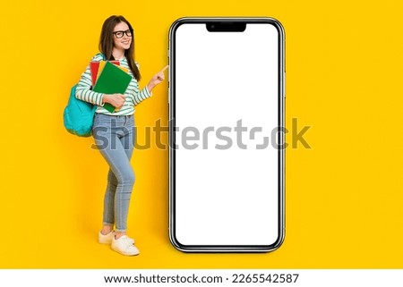 Full size photo of intelligent college student female promote placard banner isolated on yellow color background