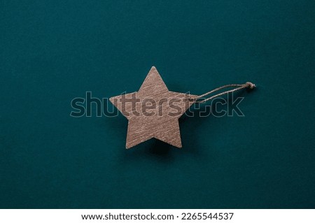 Greeting card for the Defender of the Fatherland Day. Gold star on a green background. The holiday is February 23.