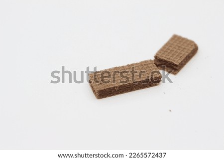 a close up of chocolate wafers isolated on white background.