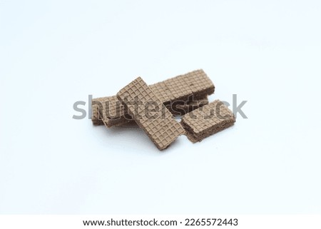 a close up of chocolate wafers isolated on white background.