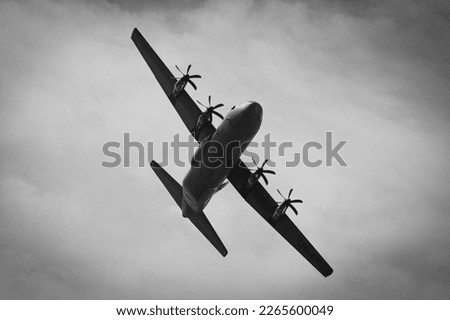 D-Day celebrations with parachutists and Dakotas and Hercules above Europe, France, Belgium and the Netherlands. Anniversary of the battle of Normandy. (DDay, D'Day, World War II or Second World War) Royalty-Free Stock Photo #2265600049
