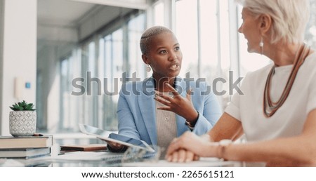 Strategy, tablet and women in discussion in business meeting for planning, communication and ideas. Teamwork, collaboration and female workers in conversation, speaking and talking about project Royalty-Free Stock Photo #2265615121