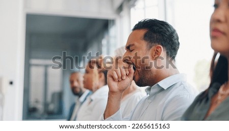 Tired, yawn and sleepless with a business man sitting in a meeting or presentation with his team for development. Yawning, exhausted and bored with a male employee suffering from insomnia at work Royalty-Free Stock Photo #2265615163