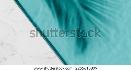 Luxury swimming pool and palm shadow in water top view. Summer tropical background for product placement podium mockup.  Royalty-Free Stock Photo #2265615899