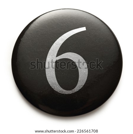 White number 6 on black round badge