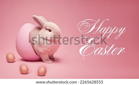 White Easter bunny with eggs on pink background isolated. Fluffy rabbit comes out of the egg. Easter background. Signature on the picture - Happy Easter