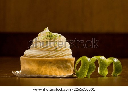 Close up of a Lemon Meringue Pie tart with lemon
