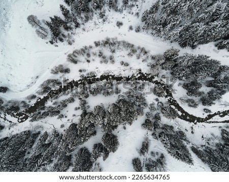 A small stream in the middle of winter in tirol Royalty-Free Stock Photo #2265634765