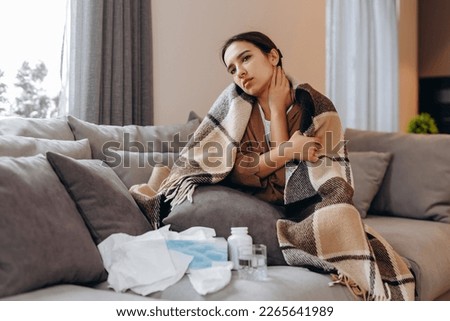 Throat Pain. Beautiful Woman Having Sore Throat, Feeling Sick. Unhappy Ill Female Suffering From Painful Swallowing, Strong Pain In Throat, Holding Hand On Her Neck. Health Concept. High Resolution Royalty-Free Stock Photo #2265641989