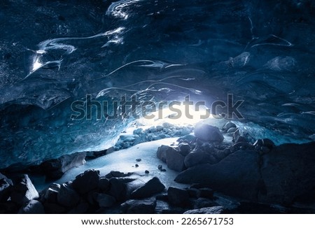 Blue glacier cave melting glacier in Switzerland