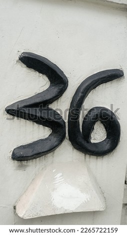 unique number in front of the neighbor's fence
