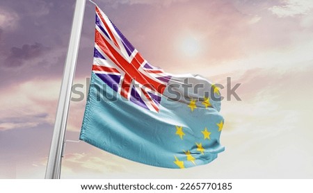 Tuvalu national flag waving in the sky.