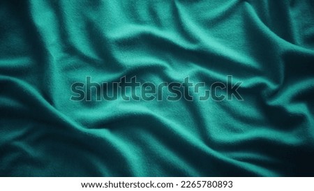 a wavy green cloth background