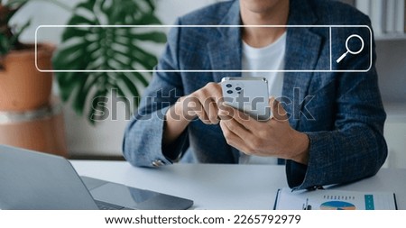 Searching Browsing Internet Data Information Networking Concept with blank search bar.man working with mobile phone and laptop computer VR icon in office
