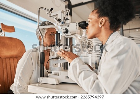 Senior eye exam, glaucoma specialist and medical eyes test of elderly woman at doctor consultation. Vision, healthcare focus and old female patient with consulting wellness expert for lens check Royalty-Free Stock Photo #2265794397