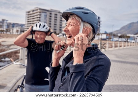Helmet, laughter and a senior couple cycling outdoor together for fitness or an active lifestyle. Summer, exercise or humor with a mature man and woman laughing on the promenade during summer