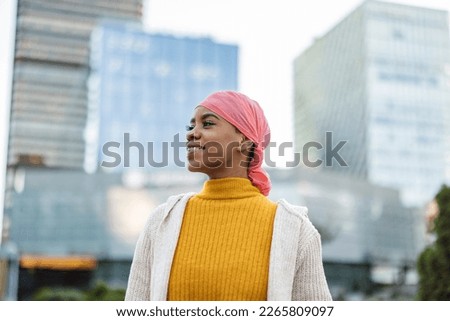 hispanic woman cancer pink scarf fight cancer symbol Royalty-Free Stock Photo #2265809097