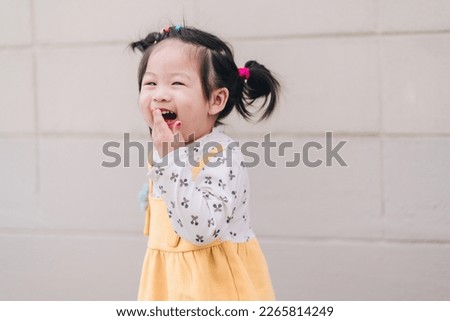 Cute little girl Asian happiness shot outdoors, 2-3 year old Royalty-Free Stock Photo #2265814249